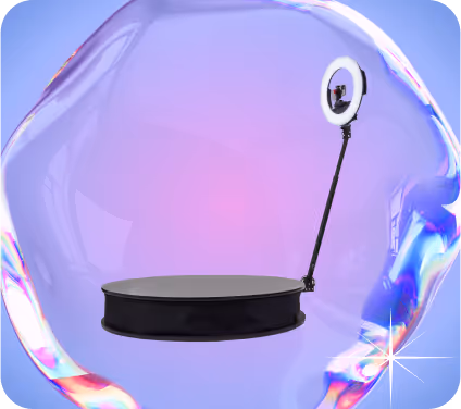 Black round platform with attached ring light inside a translucent iridescent bubble on a purple background.