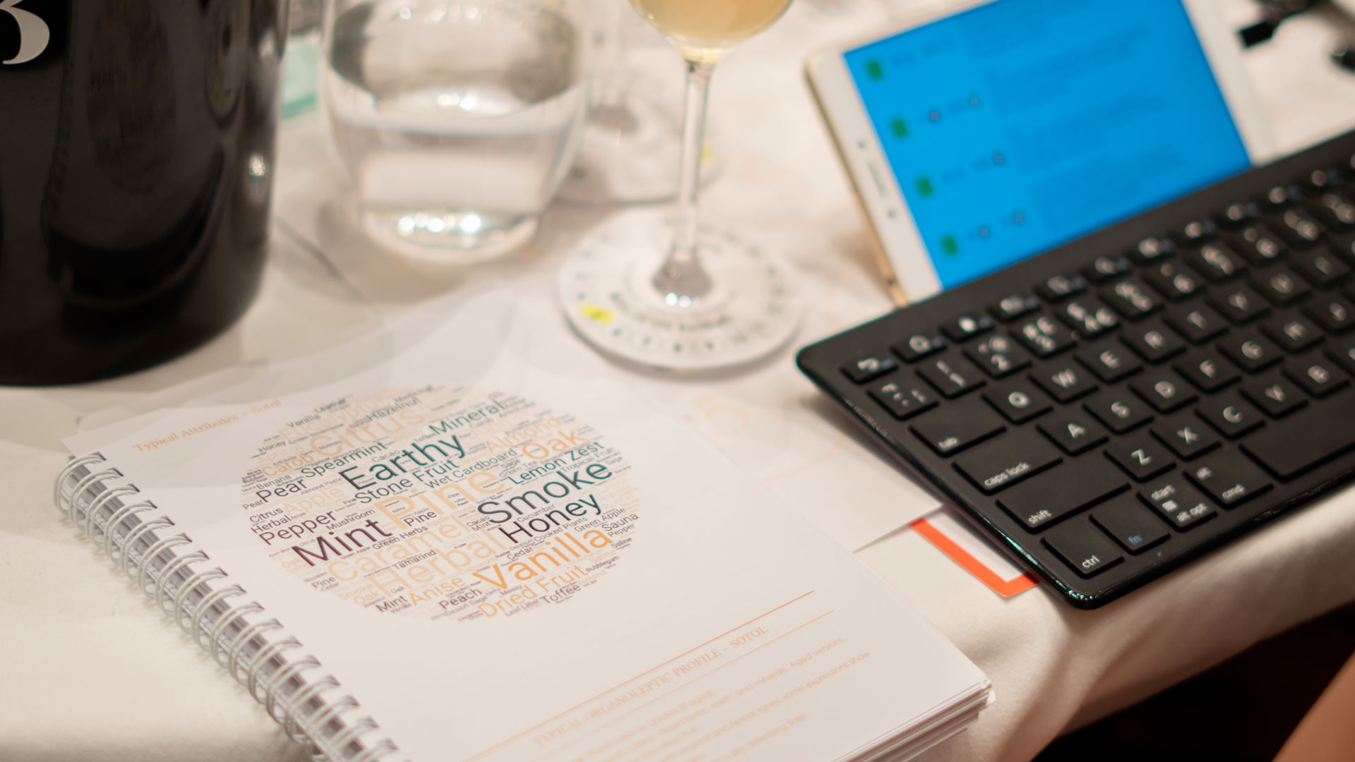 Close-up of a tasting table at Spirits Selection, featuring the official "Spirits Guideline" booklet used by judges to assess expected product characteristics.