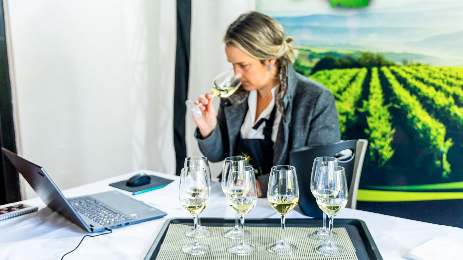 Carien Coetzee, chair of the jury, tasting a glass of Sauvignon Blanc during the 2025 FNB South Africa Sauvignon Blanc Top 10 competition.