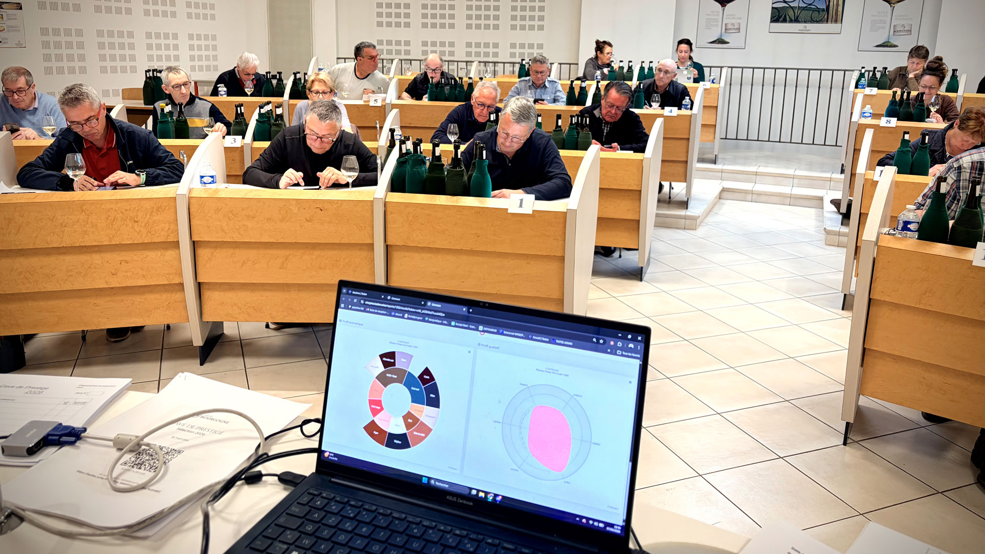 View of the BIVB Cave de Prestige tasting room from the central monitoring desk, with the Tastee interface displayed on screen for real-time tasting oversight