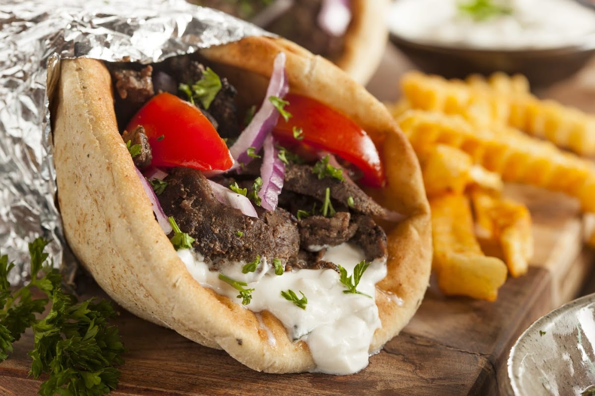 A delicious meat and veggie filled pita sandwich.
