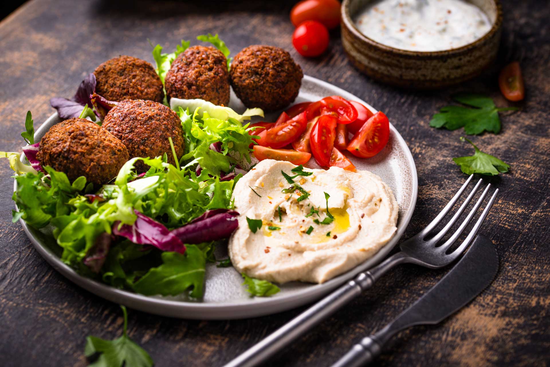 A plate of food with a fork and knife on it.