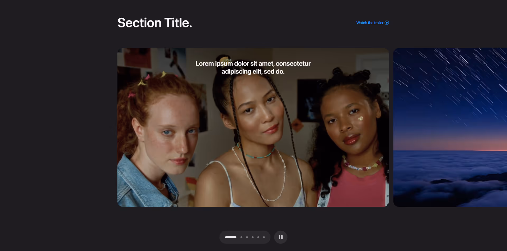 Portrait of three young women with varied hairstyles and jewelry against a softly lit indoor backdrop.