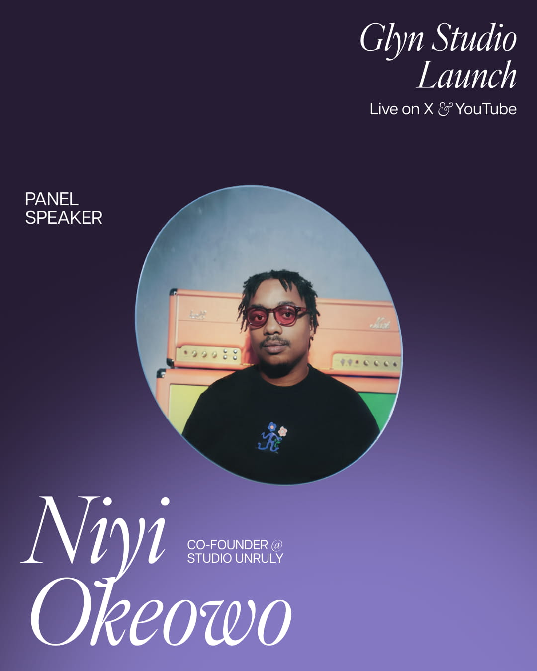 Portrait of Niyi Okeowo wearing red glasses and a black shirt with colorful amplifiers behind him.