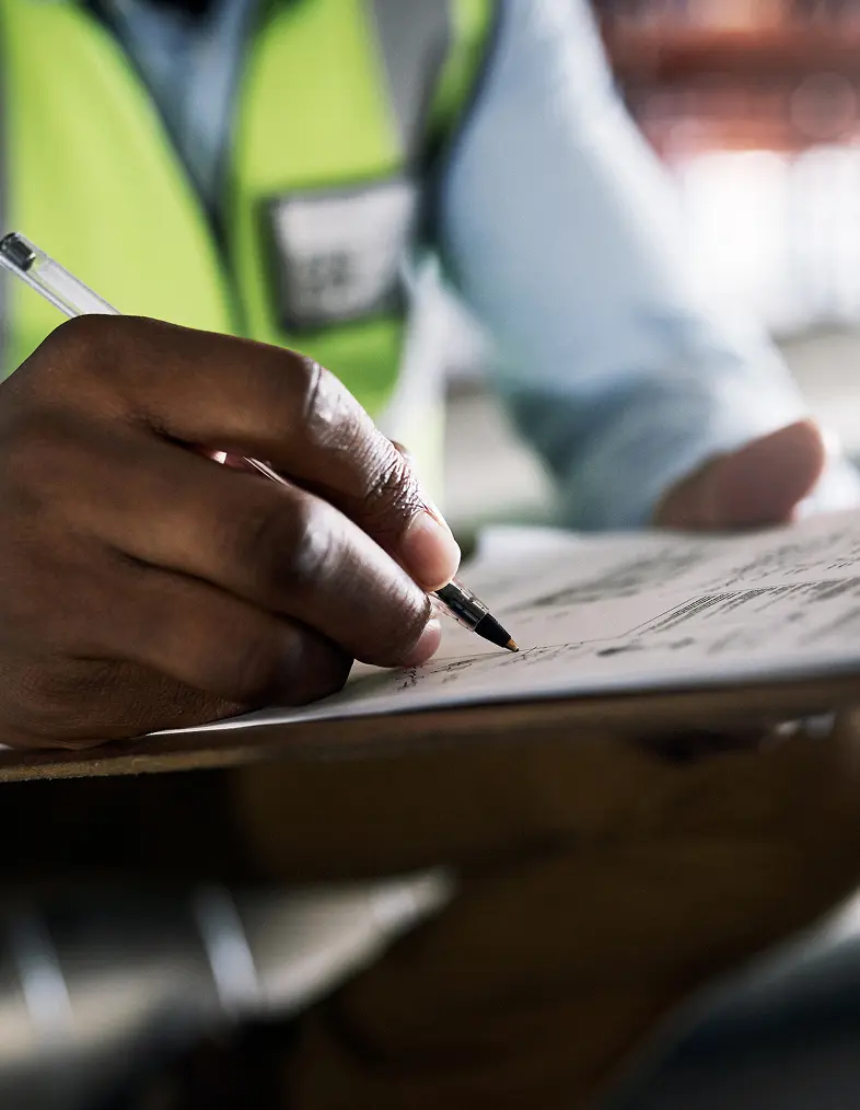 Worker signing a document