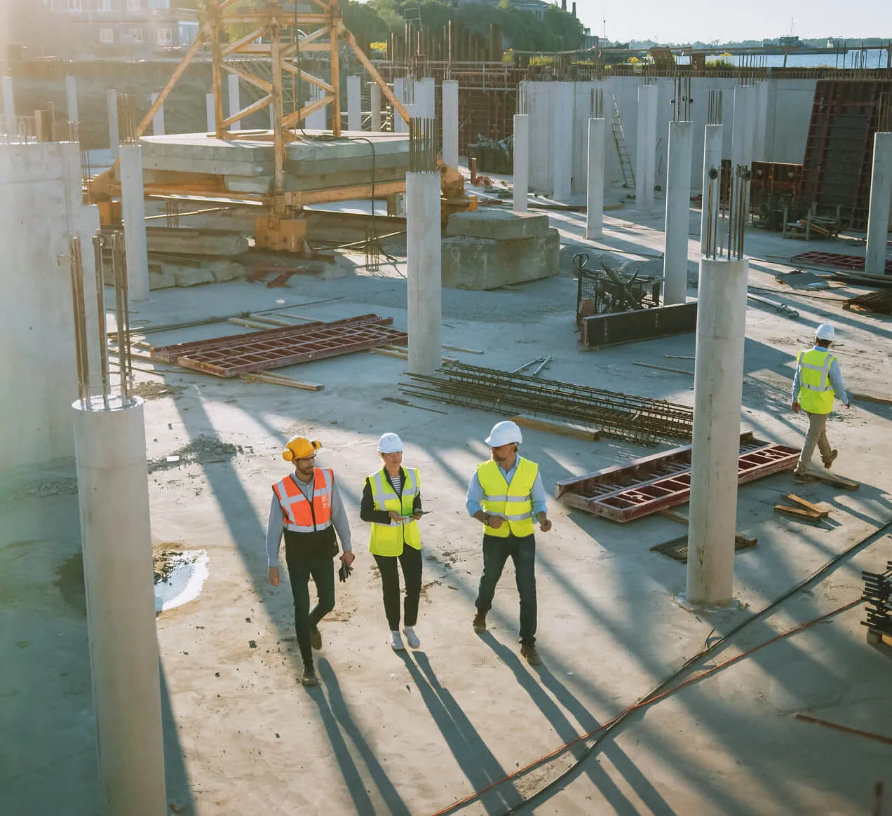 Interior of a building under construction showing metal wall studs and partially installed drywall.