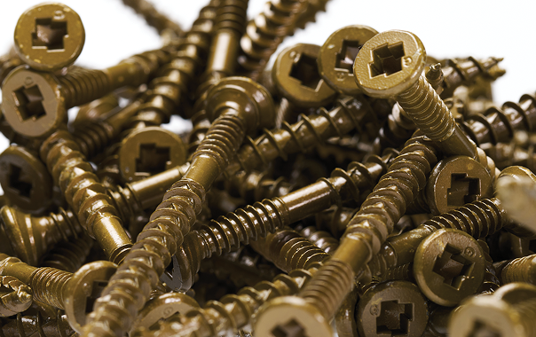Close-up view of a pile of metallic screws with square drive heads.