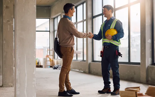 Contractors shaking hands on a jobsite