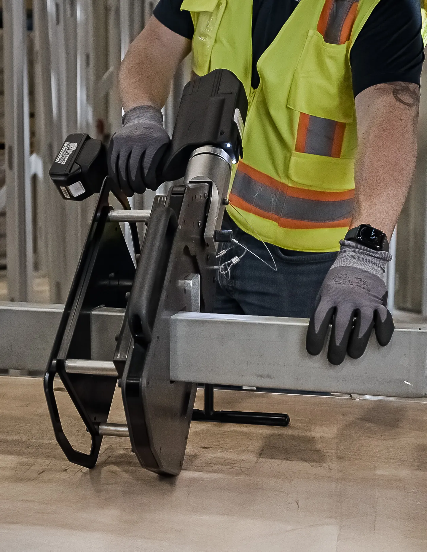 Contractor cutting steel framing with the TrueShear cutting tool
