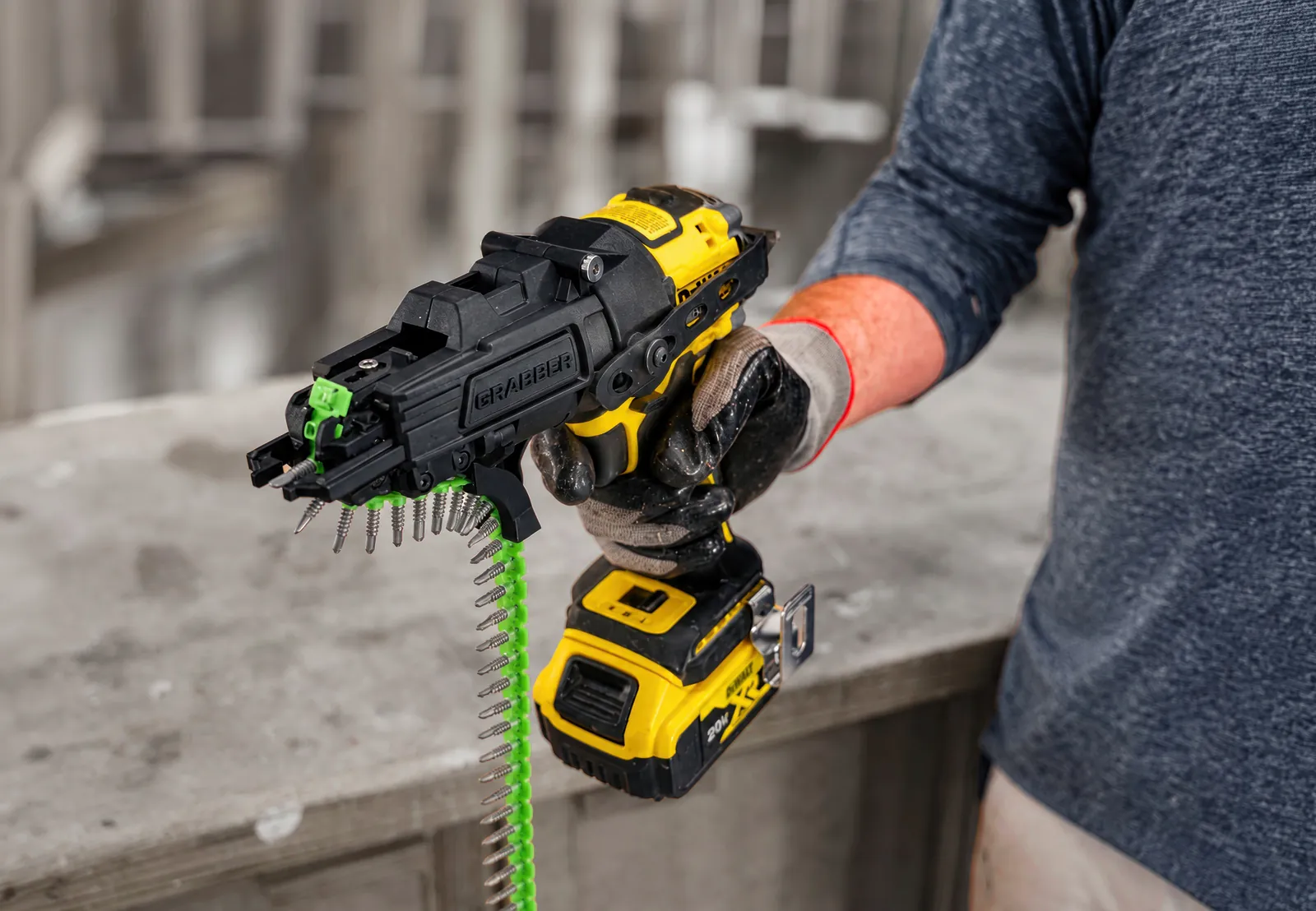 Contractor driving collated screws with a TrueFramer attachment on an impact driver