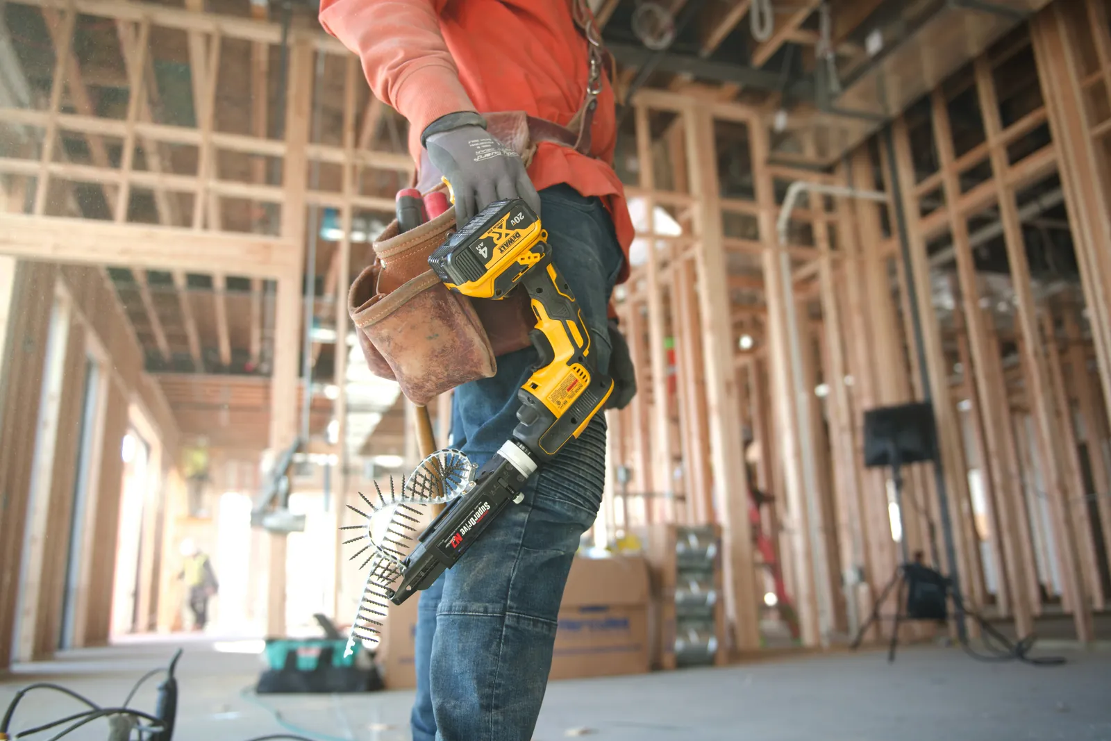 Contractor with a SuperDrive collated screw gun on their tool belt