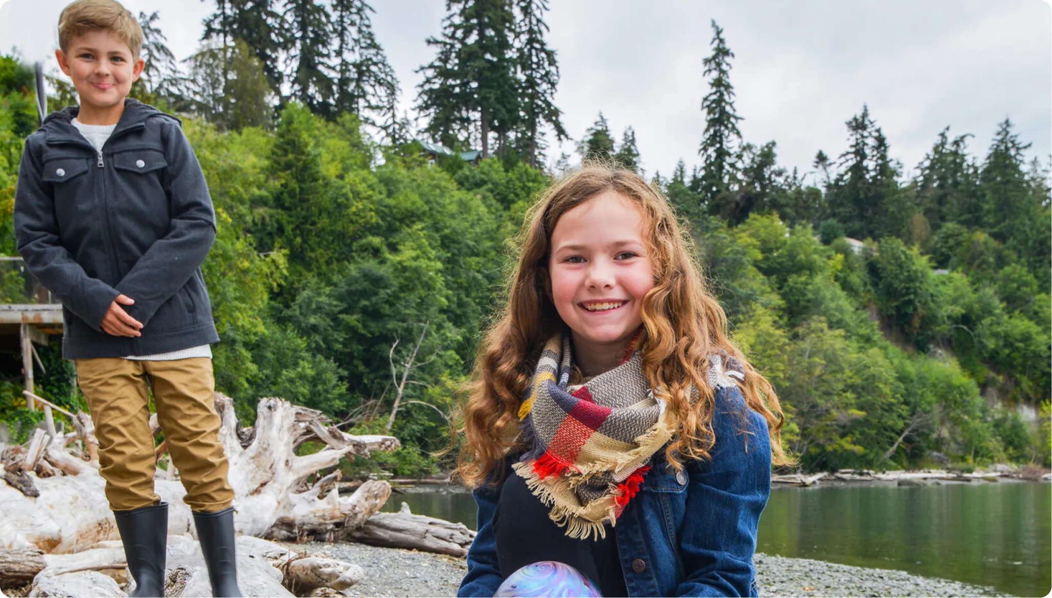 Two siblings walking on the shores of Camano Island