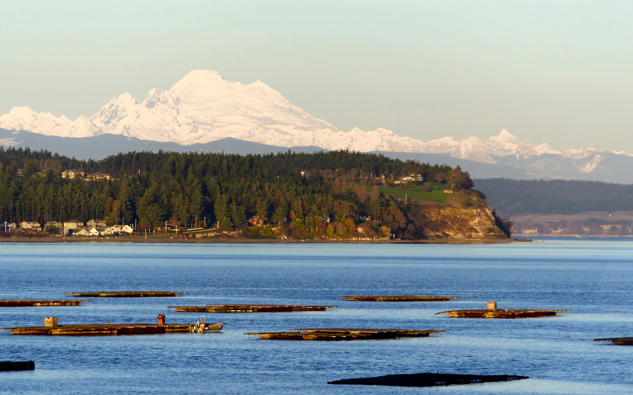 Puget Sound of water land and mountains.