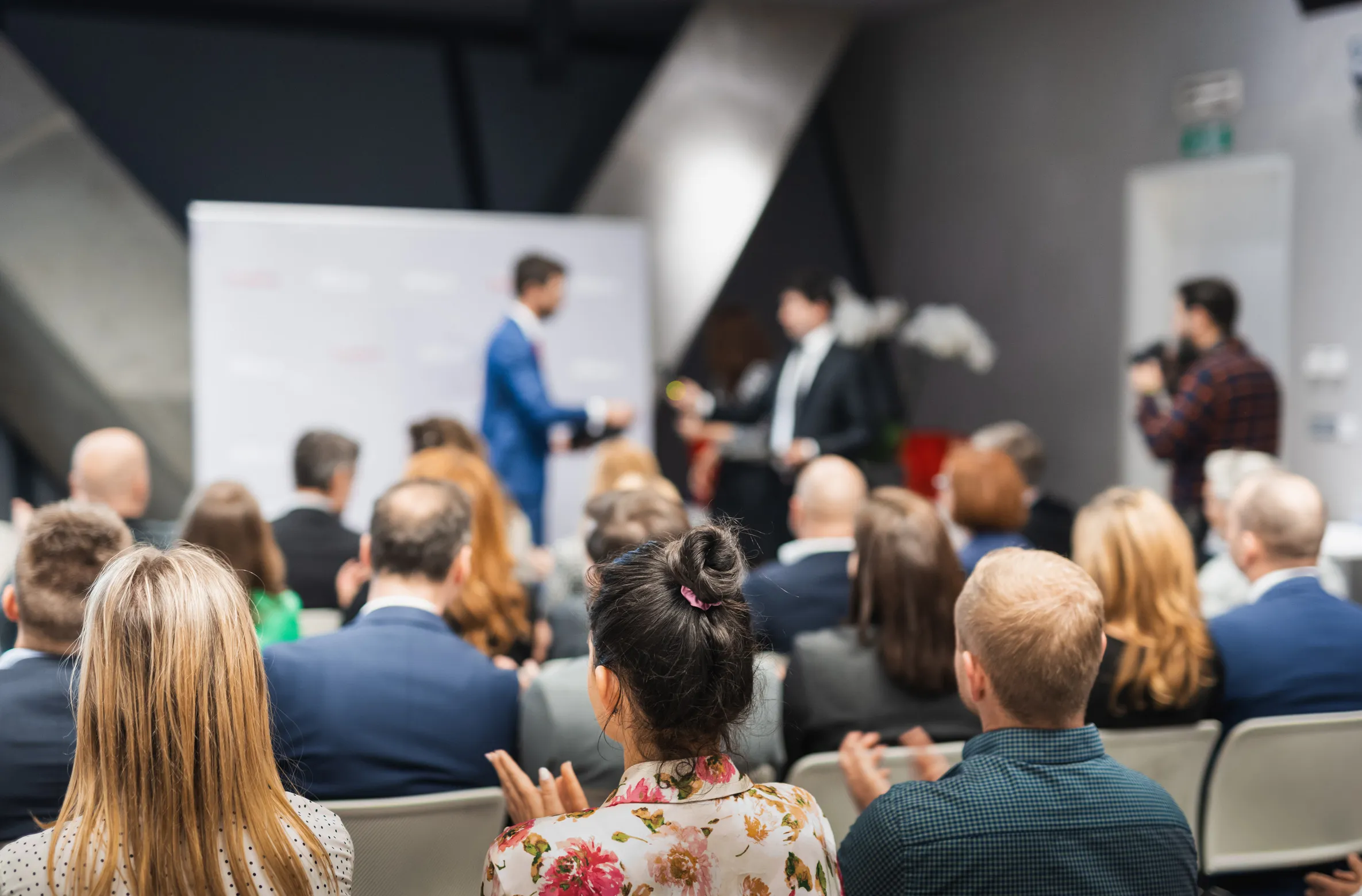 Group of business-oriented people at an awards ceremony.