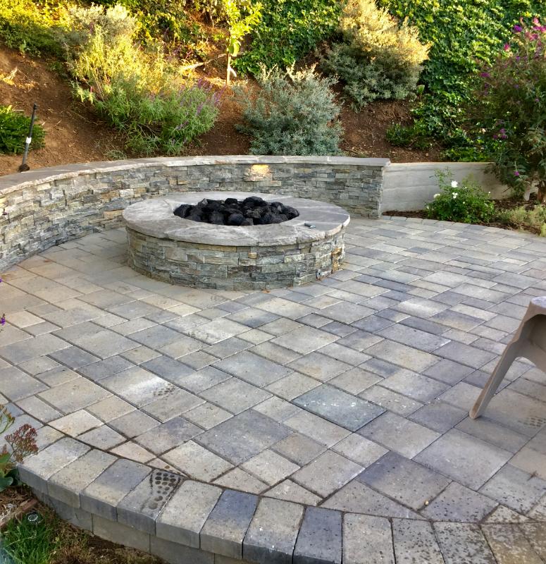 Custom Outdoor Stone Fire Pit by Jessie Flores Landscape Co. in Thousand Oaks, CA