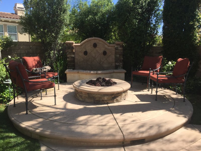 Custom Outdoor Stone Fire Pit by Jessie Flores Landscape Co. in Thousand Oaks, CA