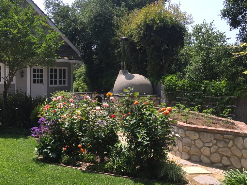 Outdoor Kitchen with Built-In Oven and Grill by Jessie Flores Landscape Co. in Thousand Oaks, CA