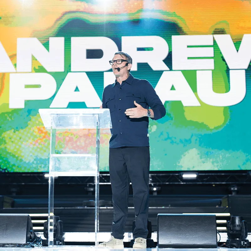 Andrew Palau on stage speaking to the audience