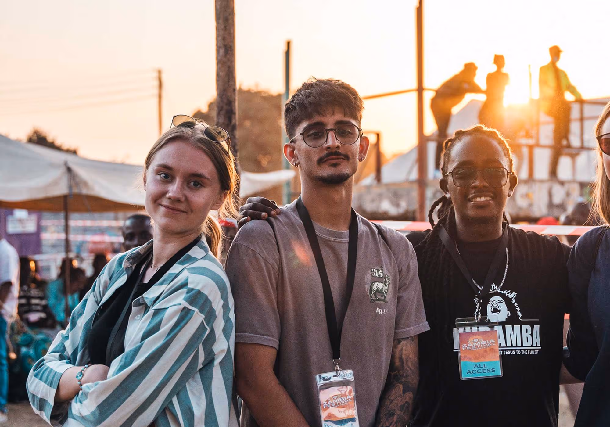 Andrew and Wendy Palau on stage smiling with a large crowd of people in the background behind them