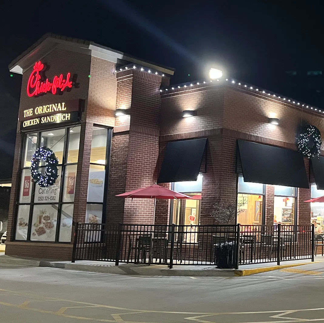 A Chick-Fil-A restaurant with Christmas lights installed for the holiday season