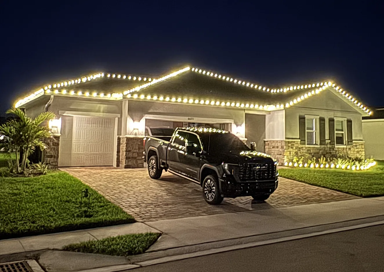 A house in Pitt County that has Christmas lights strung by Walston Evans' Christmas Lighting Installation services