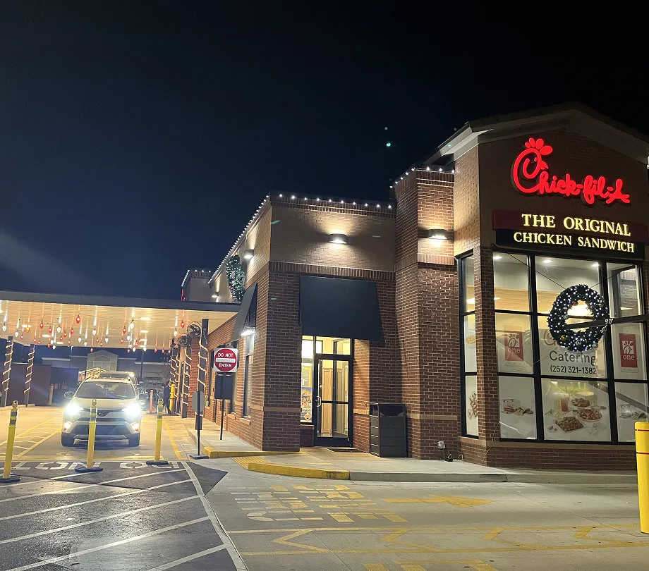 A Chick-Fil-A with Christmas lights hung