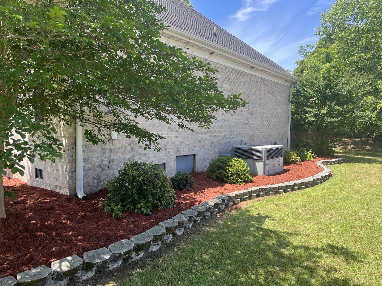 the side of a house that has been mulched by Walston Evans