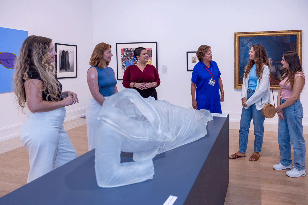 visitors in the gallery with museum docent
