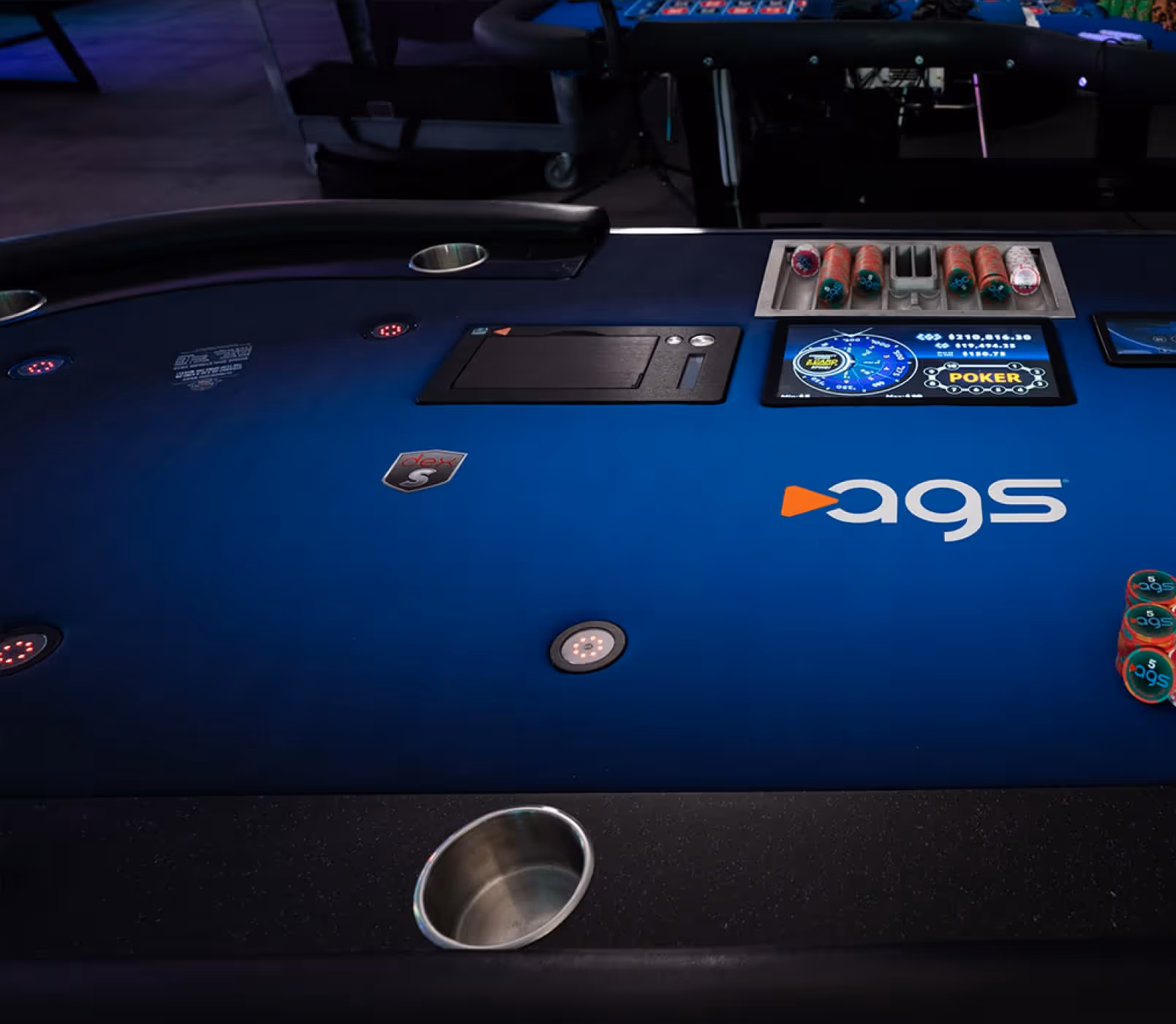 AGS poker table with chips, card reader, and electronic display