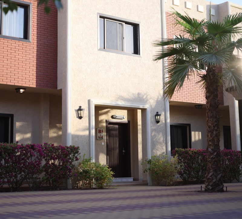 Modern residential villa at Creative Hospitality Compound in Saudi Arabia with landscaped entrance
