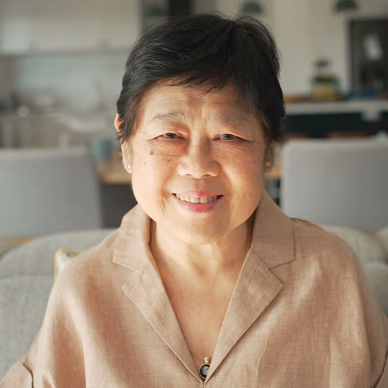 Portrait of a confident, smiling Asian senior woman. Stock photo. Posed by model.