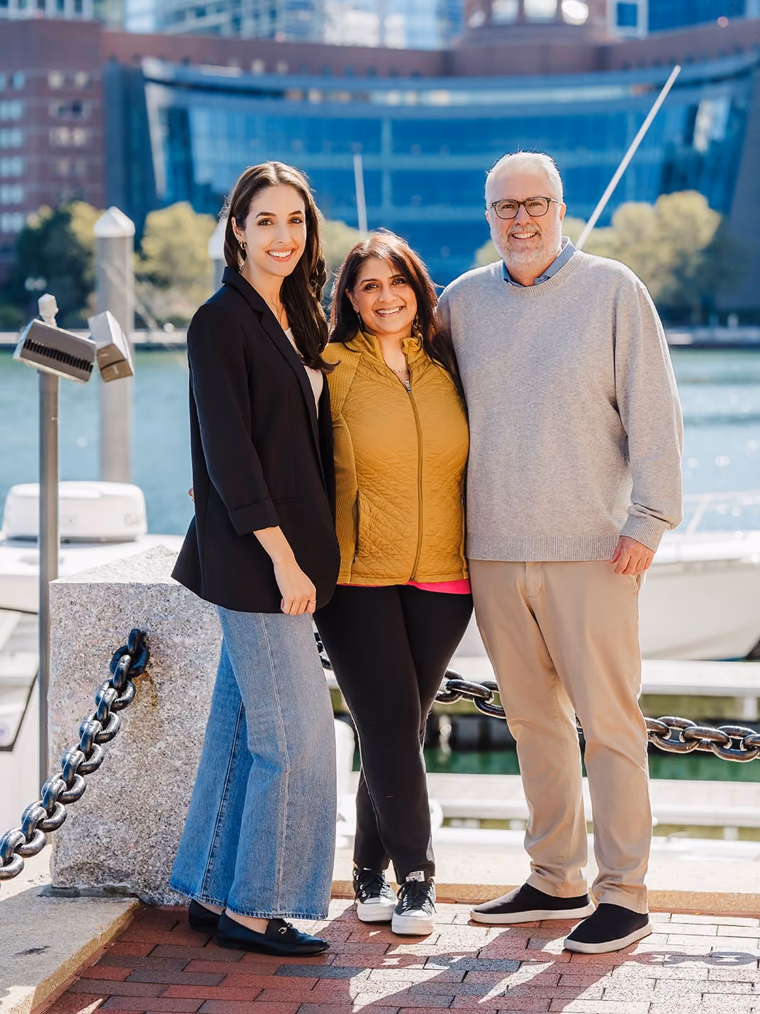 The MHJP team standing outside with the John Joseph Moakley United States Courthouse in the background.
