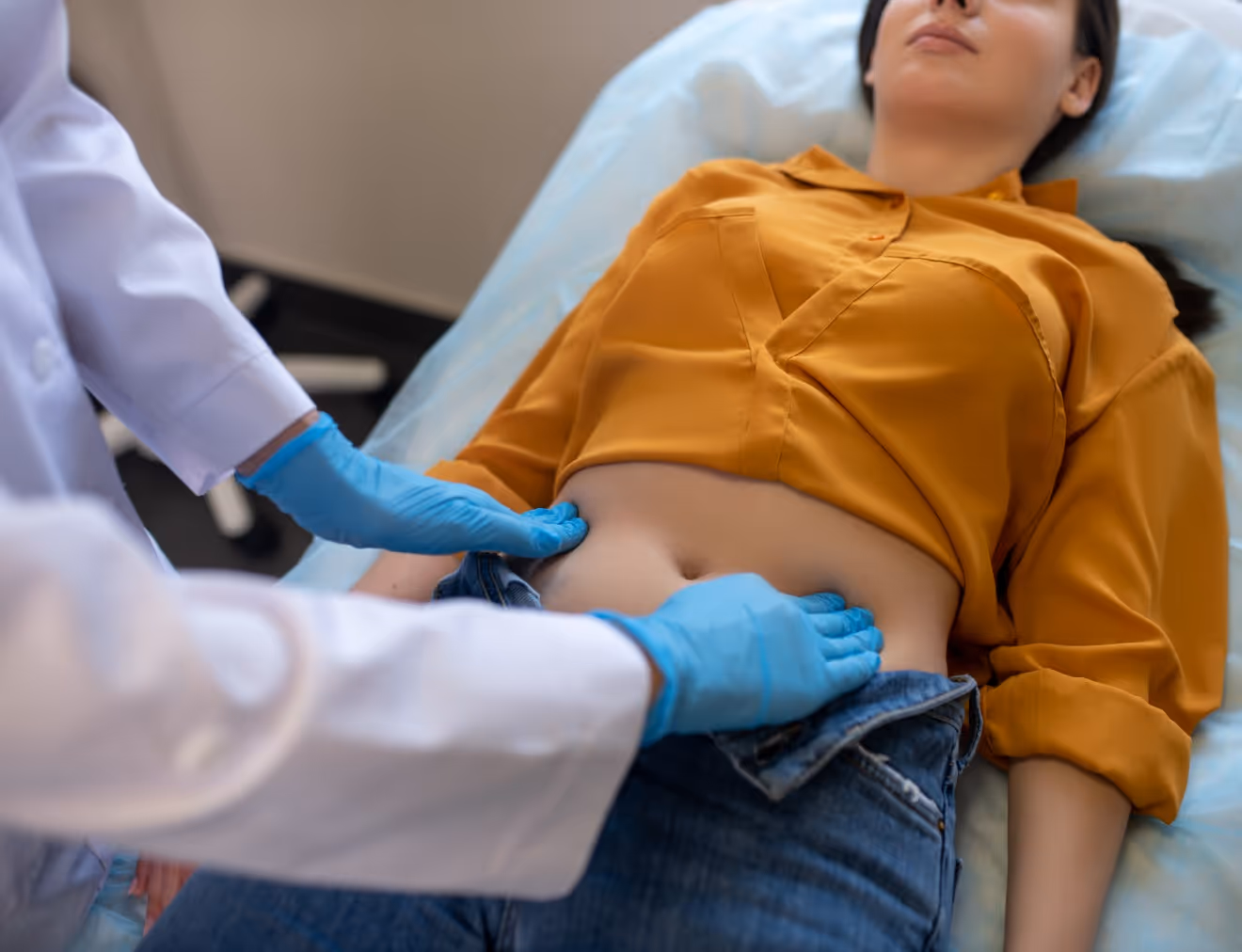 Woman in Los Angeles with persistent bloating being assessed for the root cause of her condition.