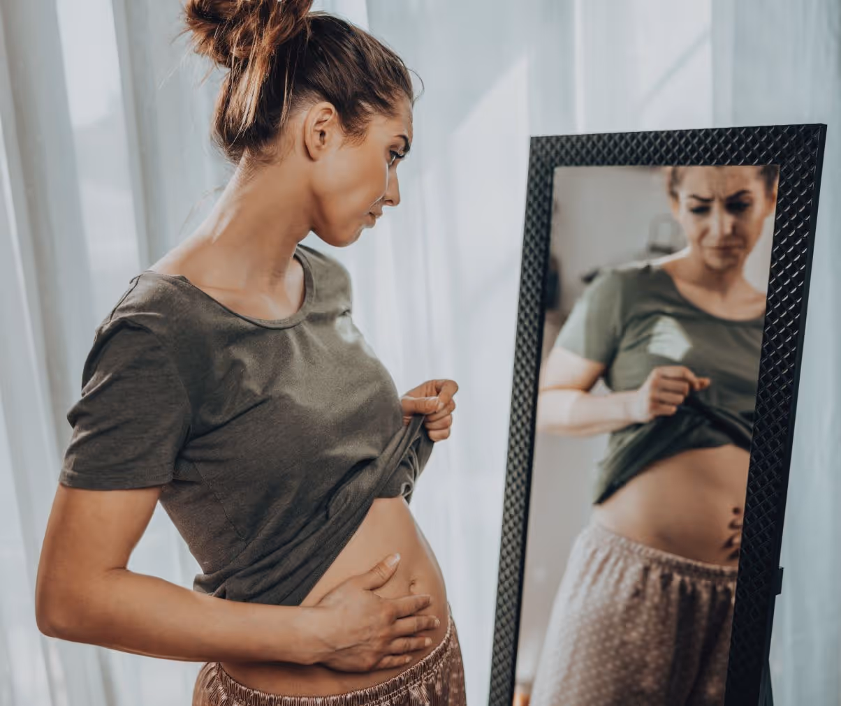 Woman in Beverly Hills considering diagnosis and treatment options for GI bloating.