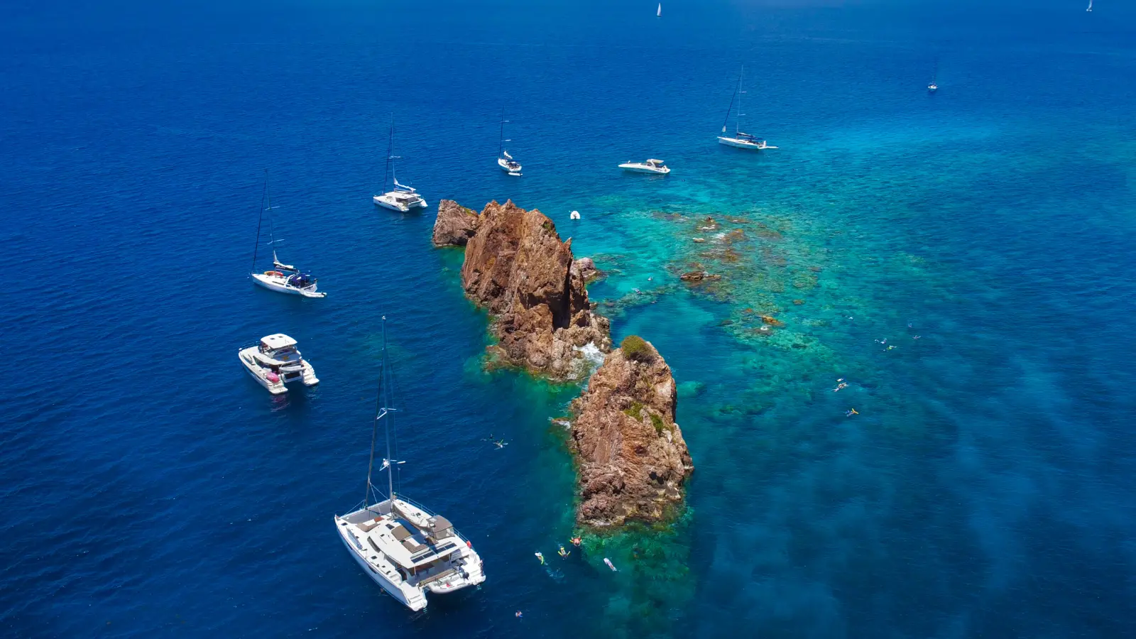 Aerial view of yachts anchored at The Indians near Norman Island in the British Virgin Islands, a popular stop on Caribbean yacht charters.