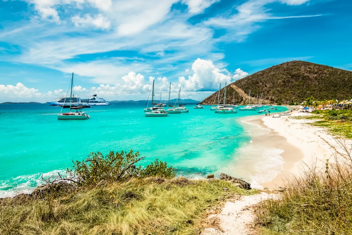 Yachts anchored in turquoise waters at White Bay on Jost Van Dyke in the British Virgin Islands, a popular stop on Caribbean yacht itineraries.
