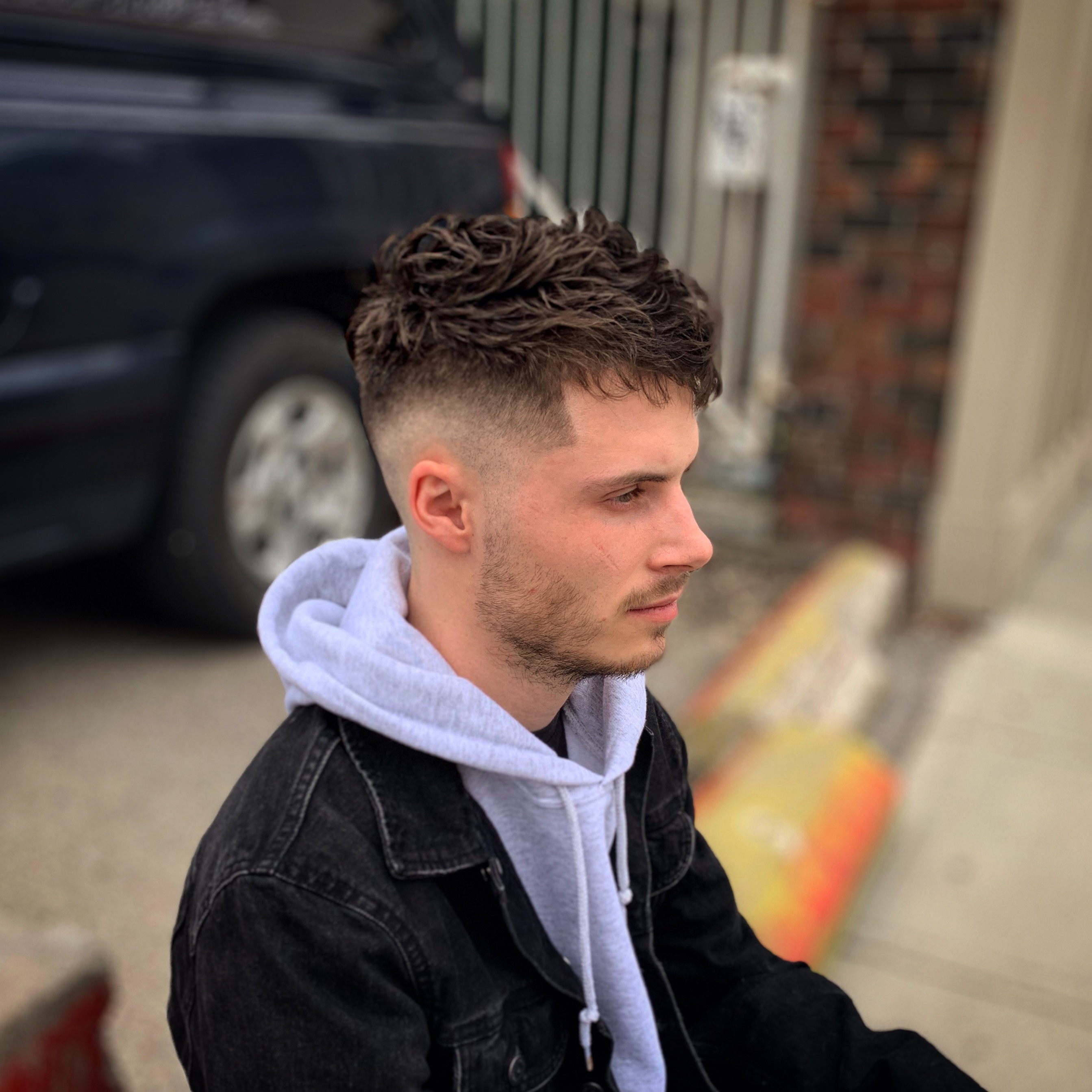 Man with high skin fade and long french crop