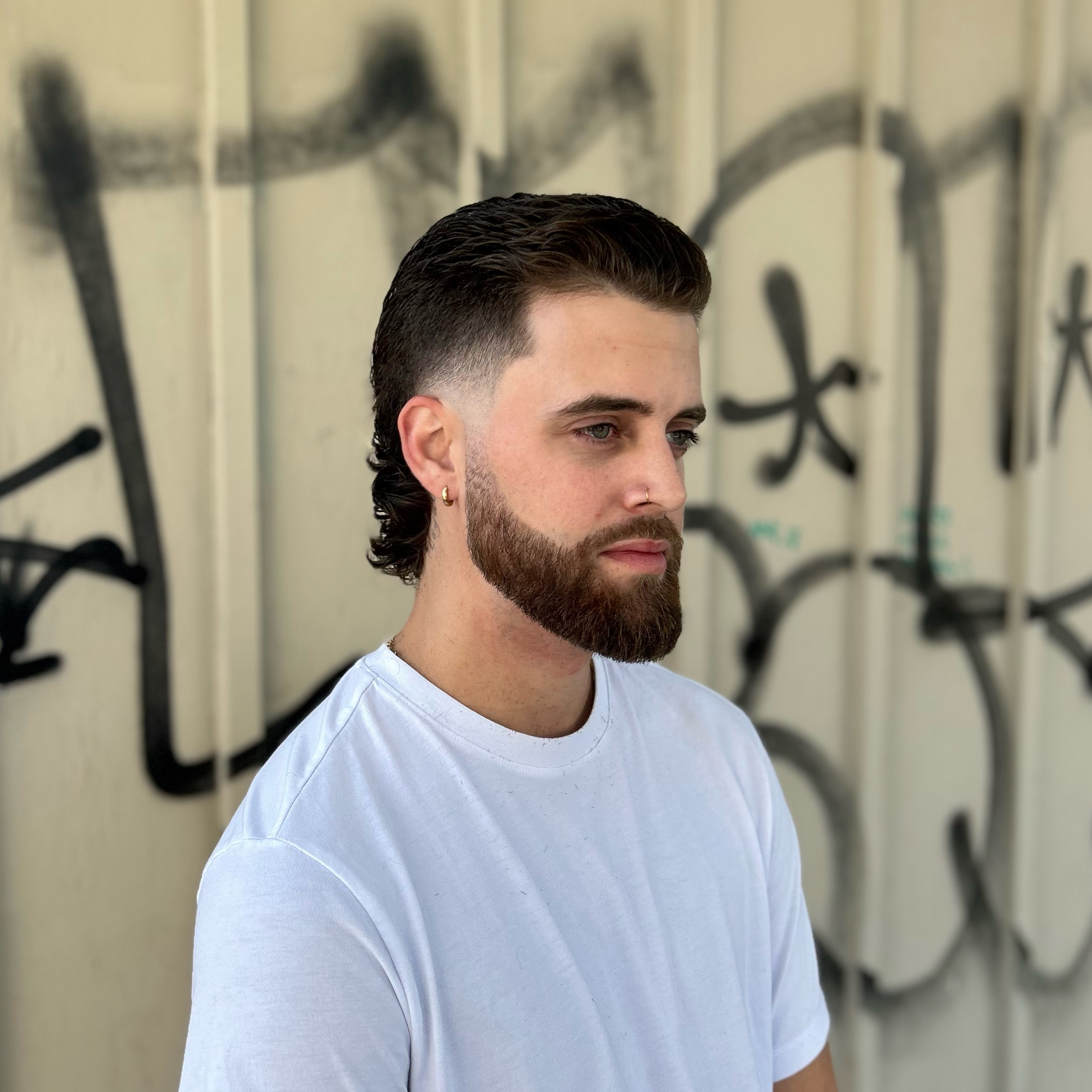 Man with beard a modern mullet