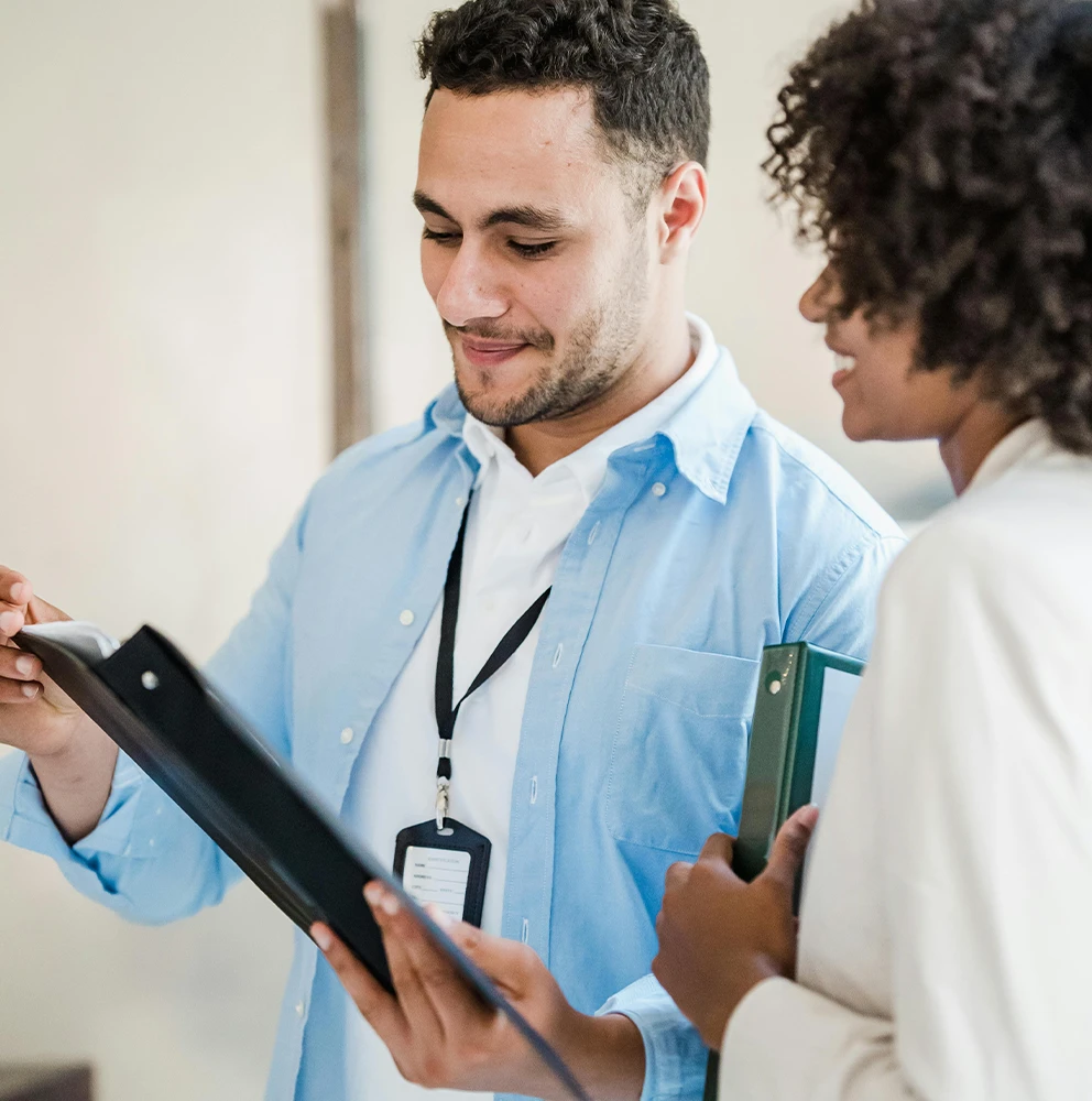 Medical researchers discussing a chart