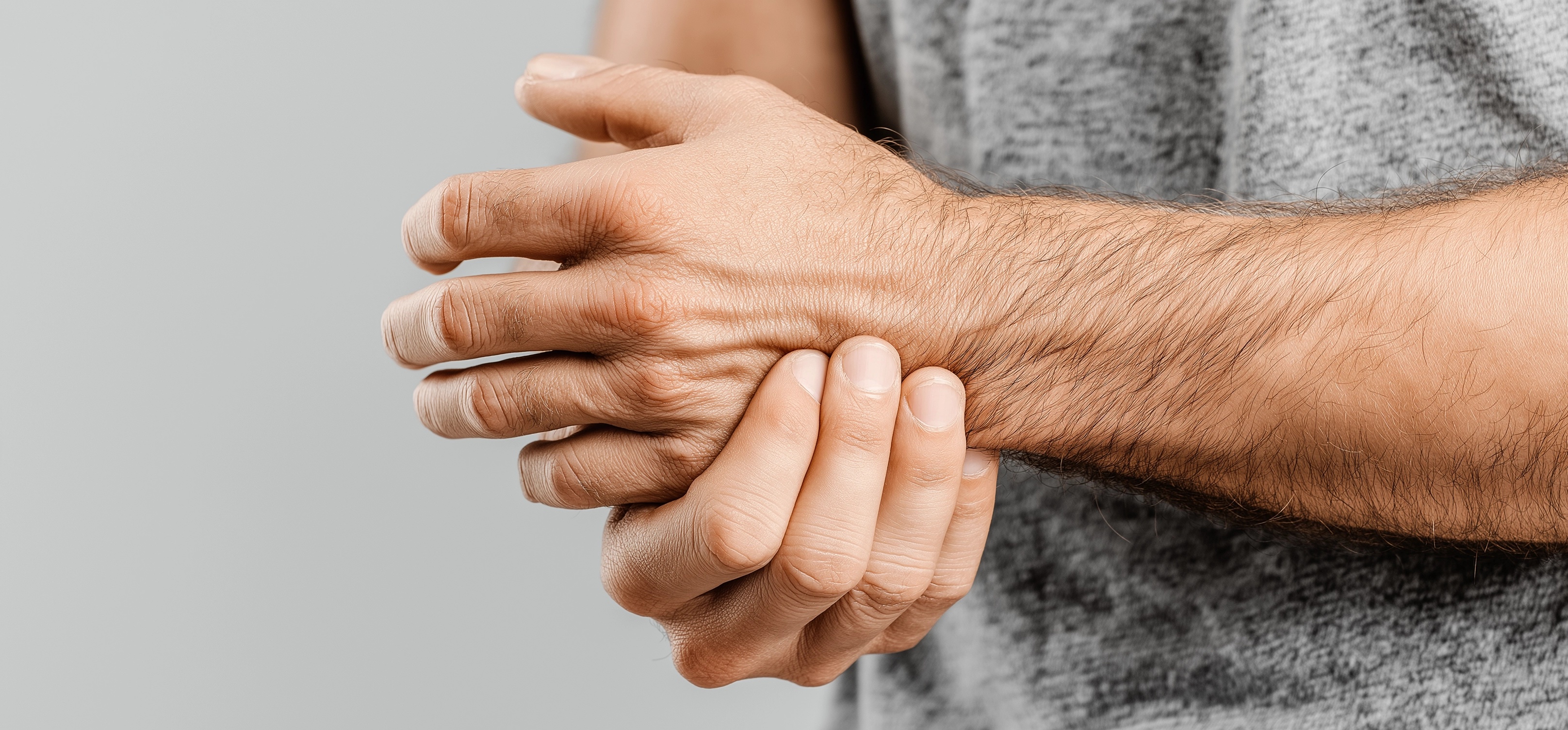 A close up of a person's hand holding another person's hand.