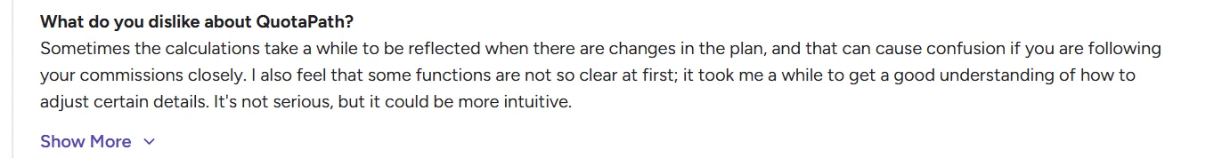 User review noting delayed commission calculations and lack of intuitive interface in Quotapath.