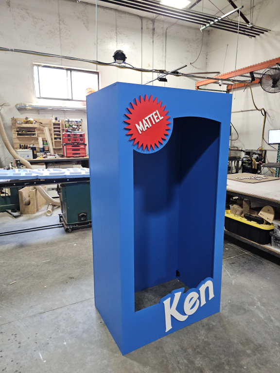 Blue Ken-themed photo booth backdrop