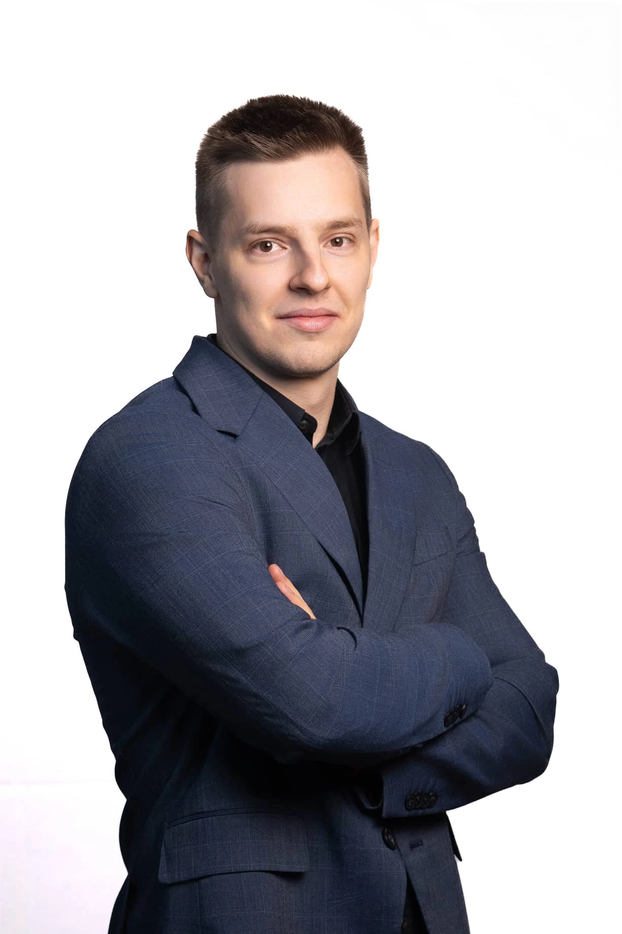 a man in a suit posing for a picture