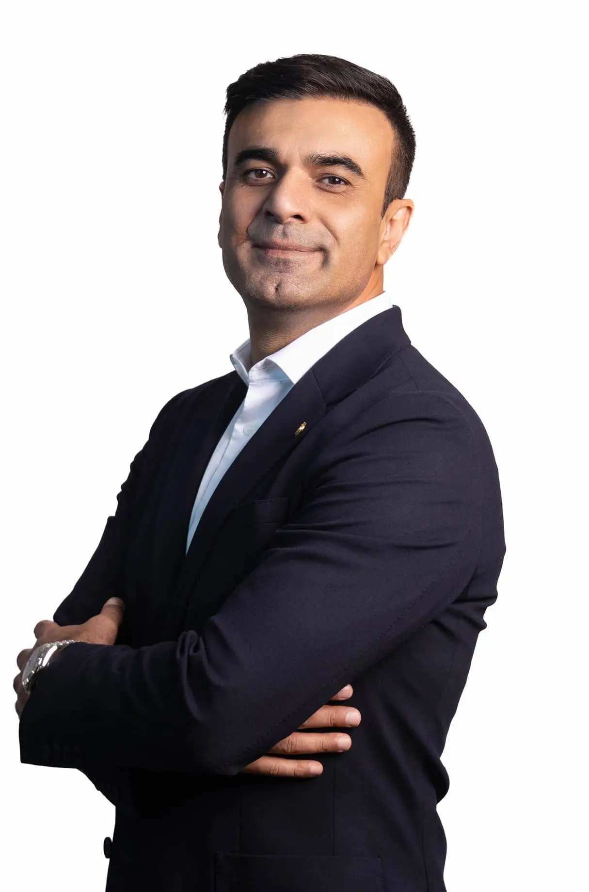 a man in a suit and tie posing for a picture