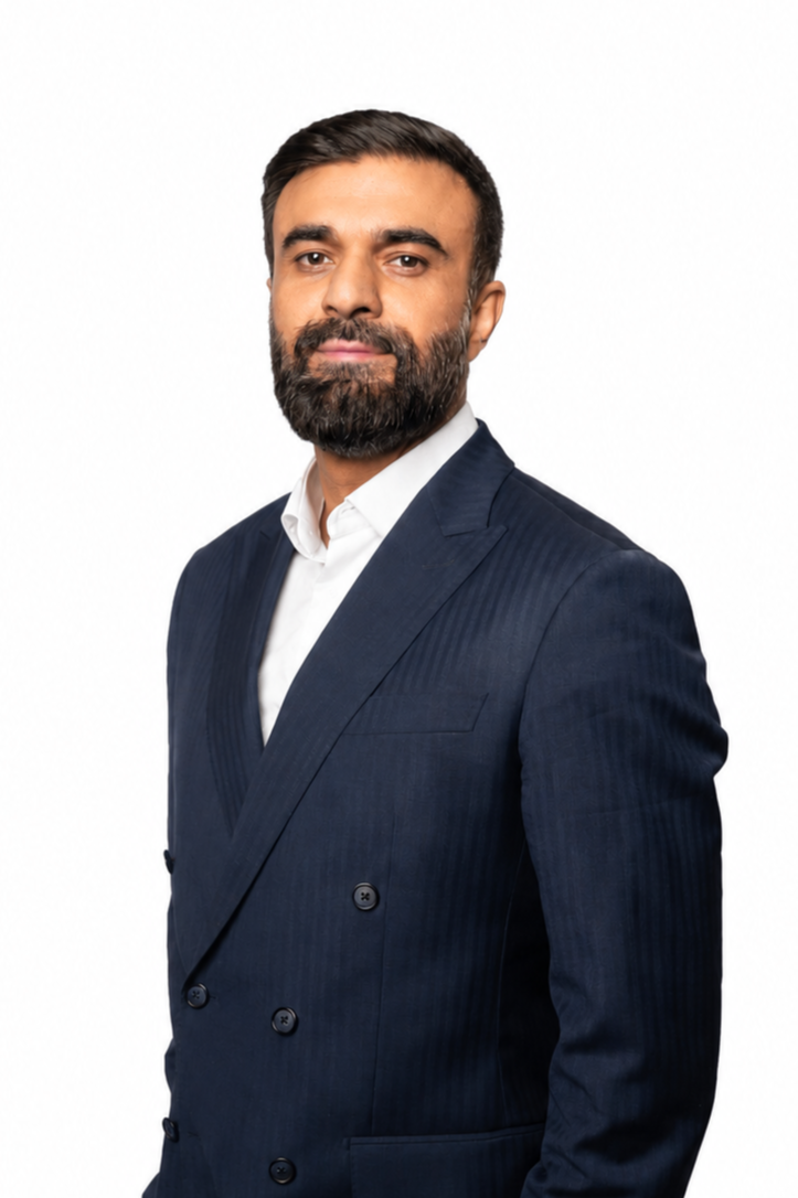 a man in a suit and tie posing for a picture