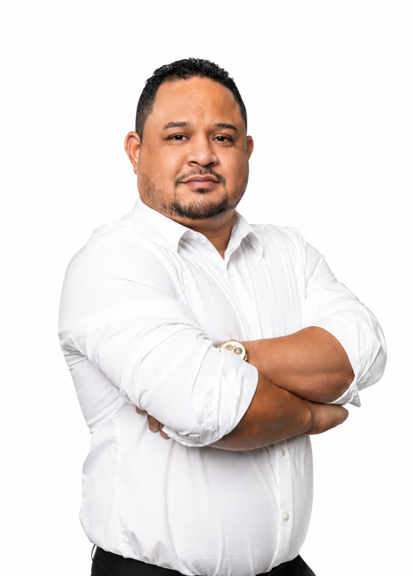 a man with his arms crossed posing for a picture