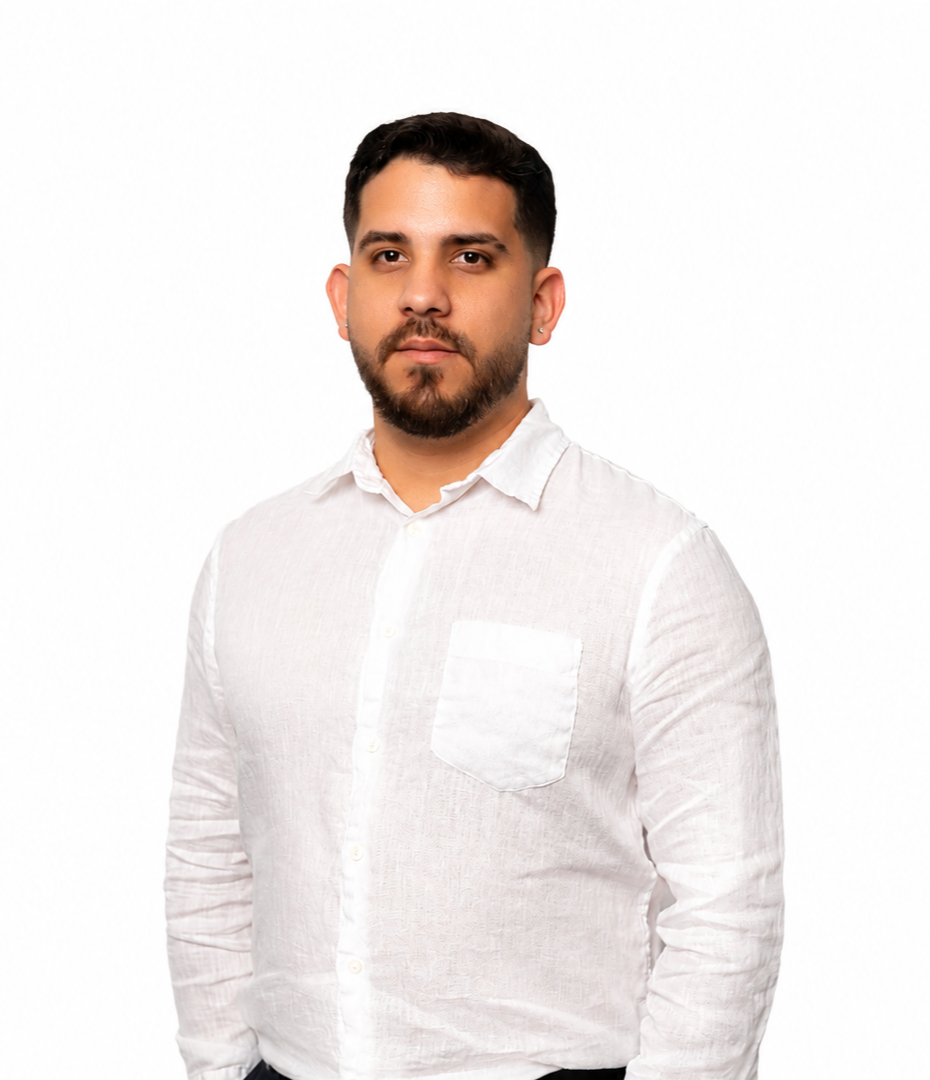 a man with his arms crossed posing for a picture