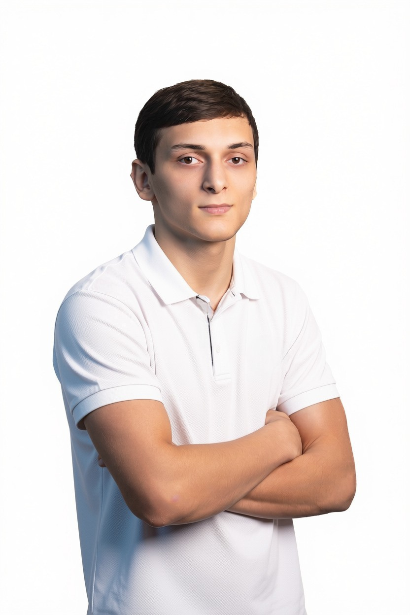 a man with his arms crossed posing for a picture