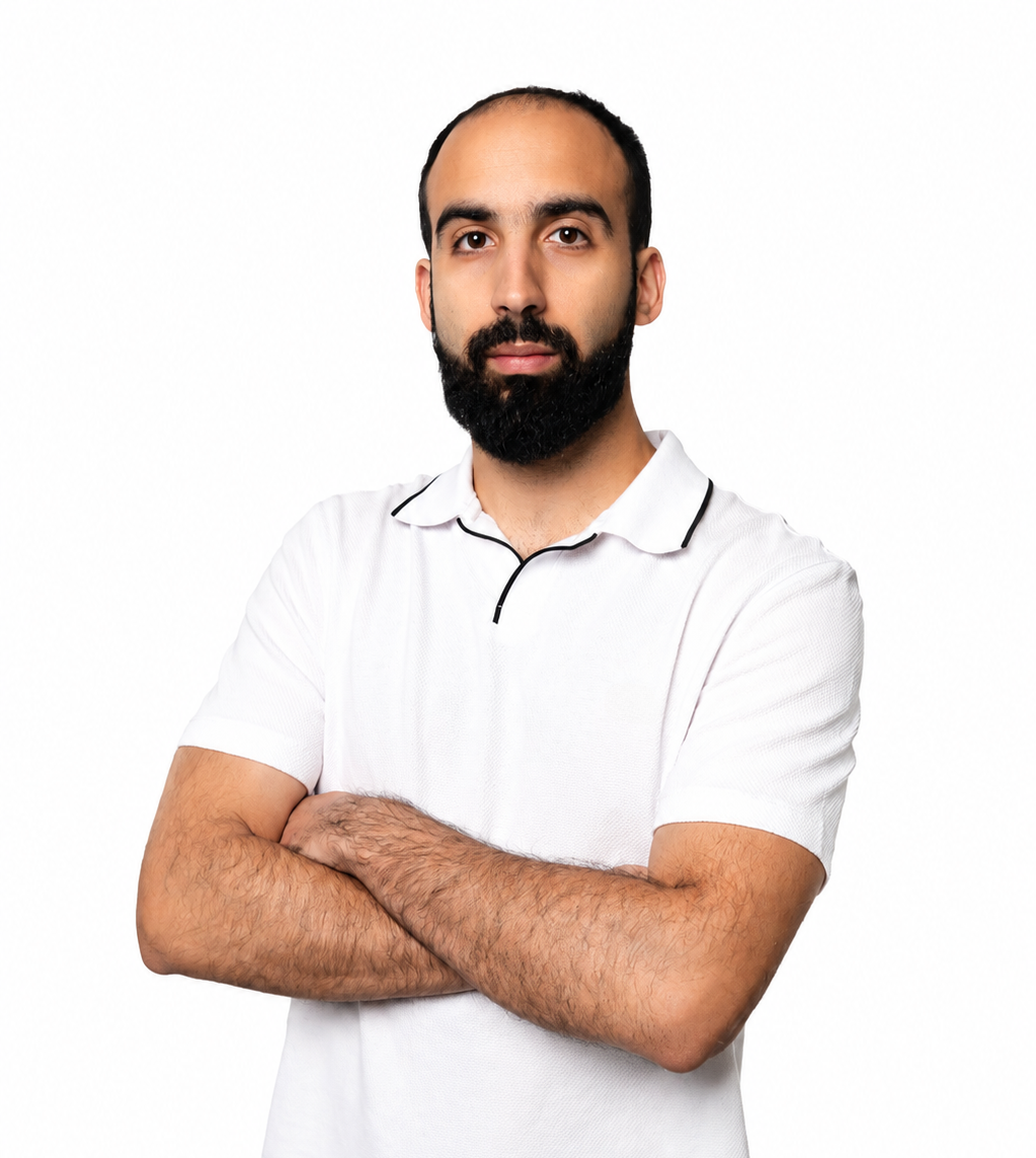 a man with a beard wearing a polo shirt