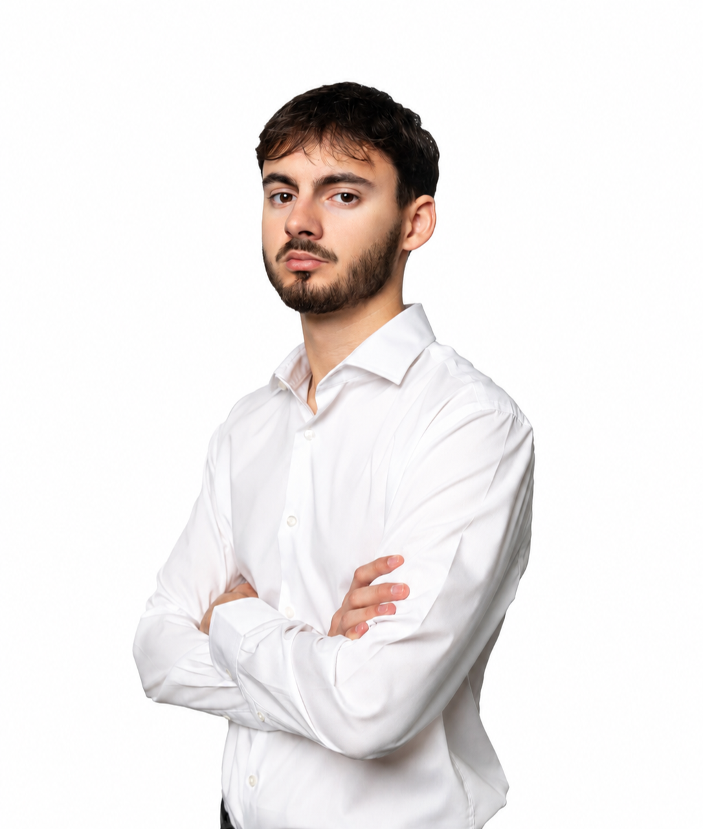 a man with his arms crossed posing for a picture